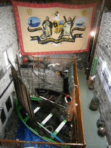 Ther is so much "stuff" collected in the museum - here are two old fishing boats plus religeous banners etc etc