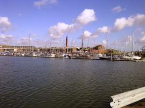 View across the Grimsby marina with the 309 ft Victorian Dock Tower behind. The tower is by the commercial dock, which is still busy.