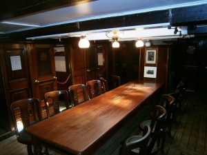 The Wardroom where the officers and senior scientists lived. The cabins open directly off this room. The table and chairs are fixed to the floor, although the chairs swivel