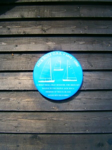 Memorial plaque to the great dinghy designer Jack Holt OBE at the Chichester Yacht Club. Jack Holt design many popular dinghies including the GP14, Solo, Enterprise, Cadet, National 12 and 14, Merlin Rocket, Streaker and Mirror to name only a few of his prolific designs. he lived at Putney but was associated with many sailing clubs including Chichestr, where he often sailed his Solo. His pioneering designs of dinghies using plywood did much to popularise the sport of sailing in the period immediately following World War II. Yvonne and I both learnt to sail in Jack Holt designed dinghies and still sail in them today. Many of his designs have had new life breathed into them by the use of modern materials and construction techniques.