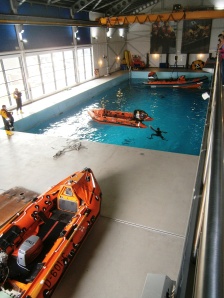 The Survival Training tank with Inshore Life Boat (ILB) righting training going on.