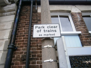Some signs take a while to remove - this one became obsolete in 1984 when trains ceased to run down on the quay.
